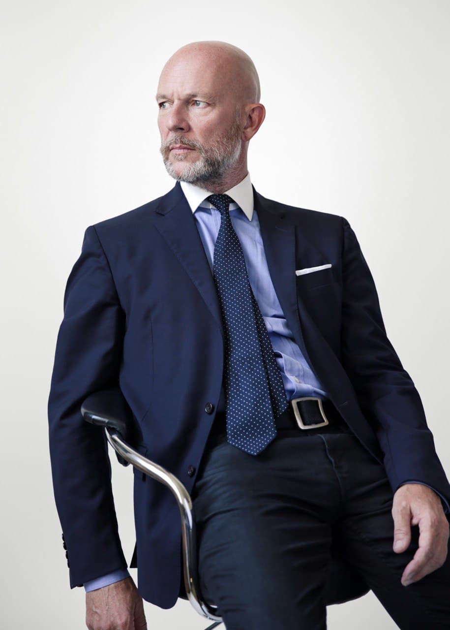 Terry Devine laughing under studio lights